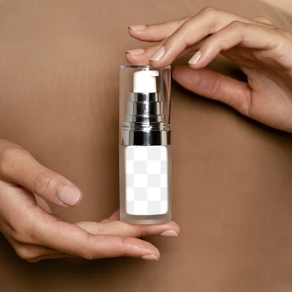 Hands holding a clear airless serum pump
